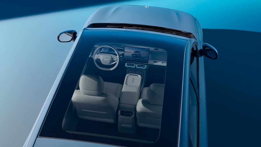 Fills the cabin with natural light for an airy feel, while the electric sunshade keeps glare in check.